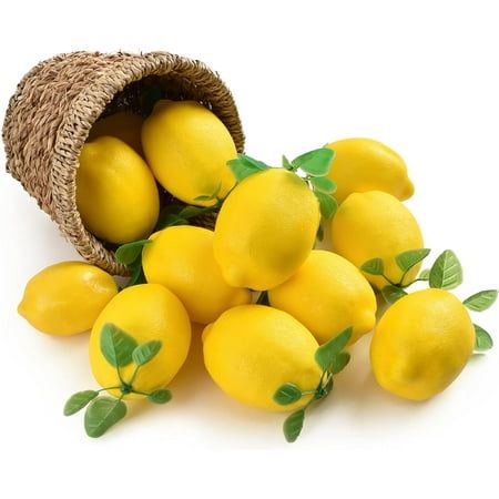 a bunch of lemons sitting on top of each other next to a wicker bag