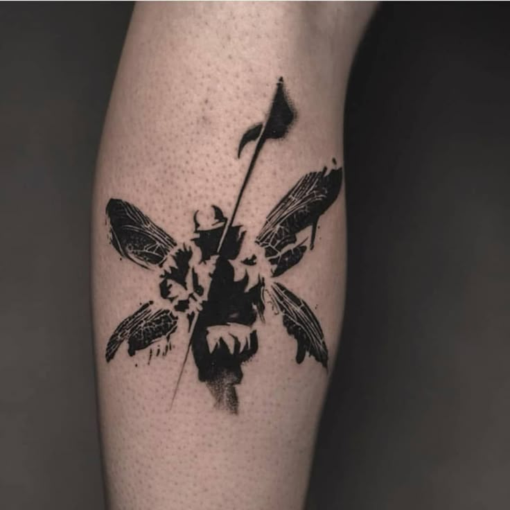 a black and white photo of a flower with feathers on it's leg,