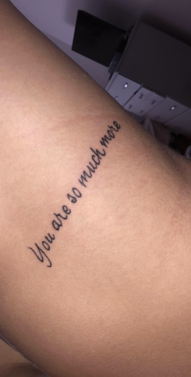 a woman's thigh with the words you are always in cursive writing