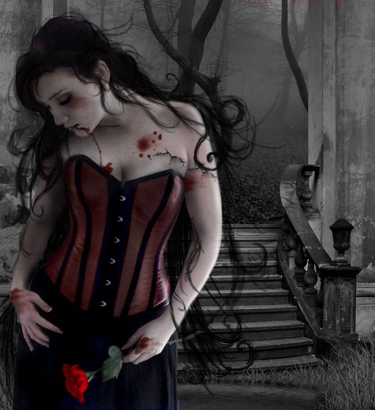 a woman with blood on her body standing in front of stairs