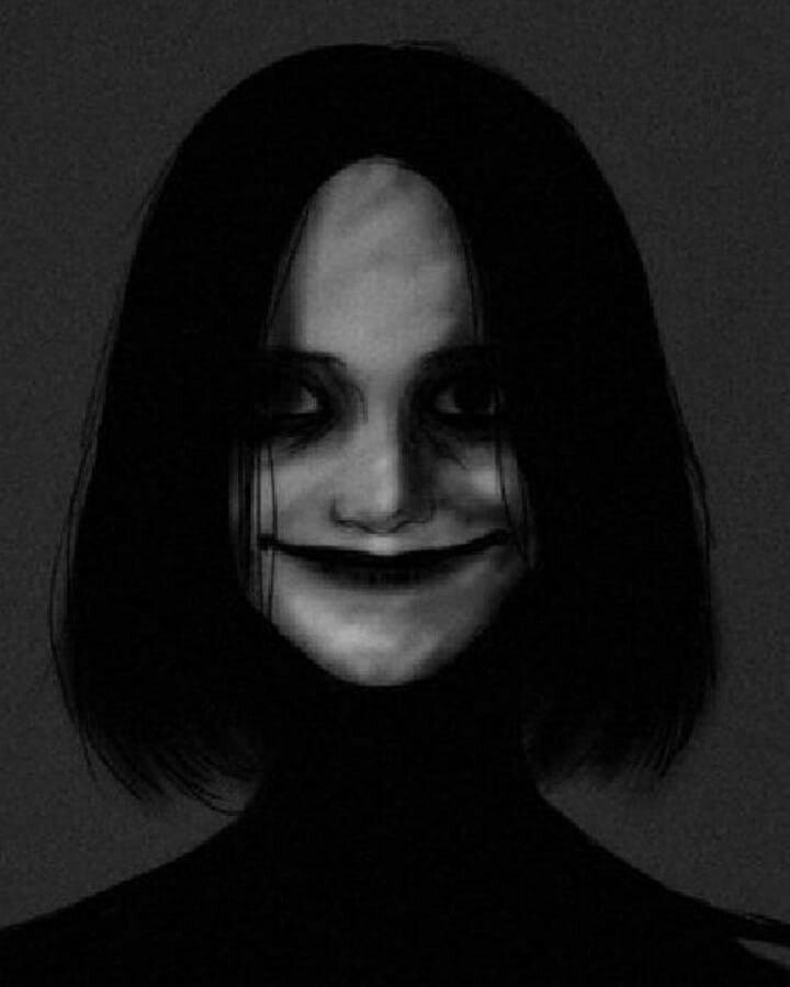 a black and white photo of a woman with her face painted like a creepy smile