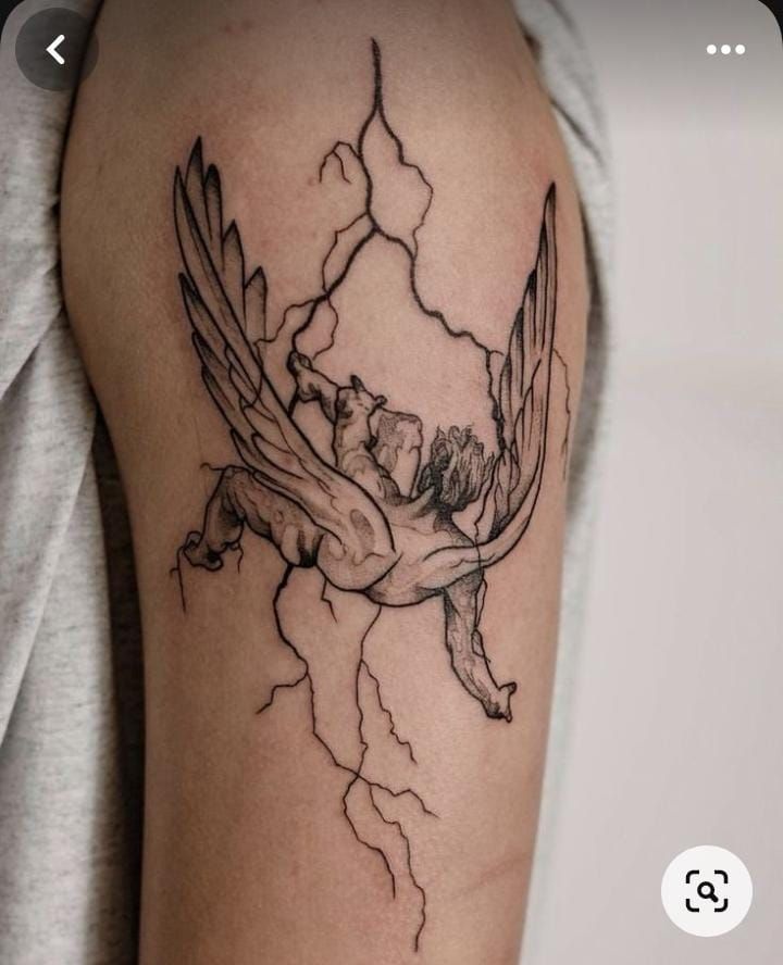 a woman's arm with a tattoo on it that has a bird and lightning