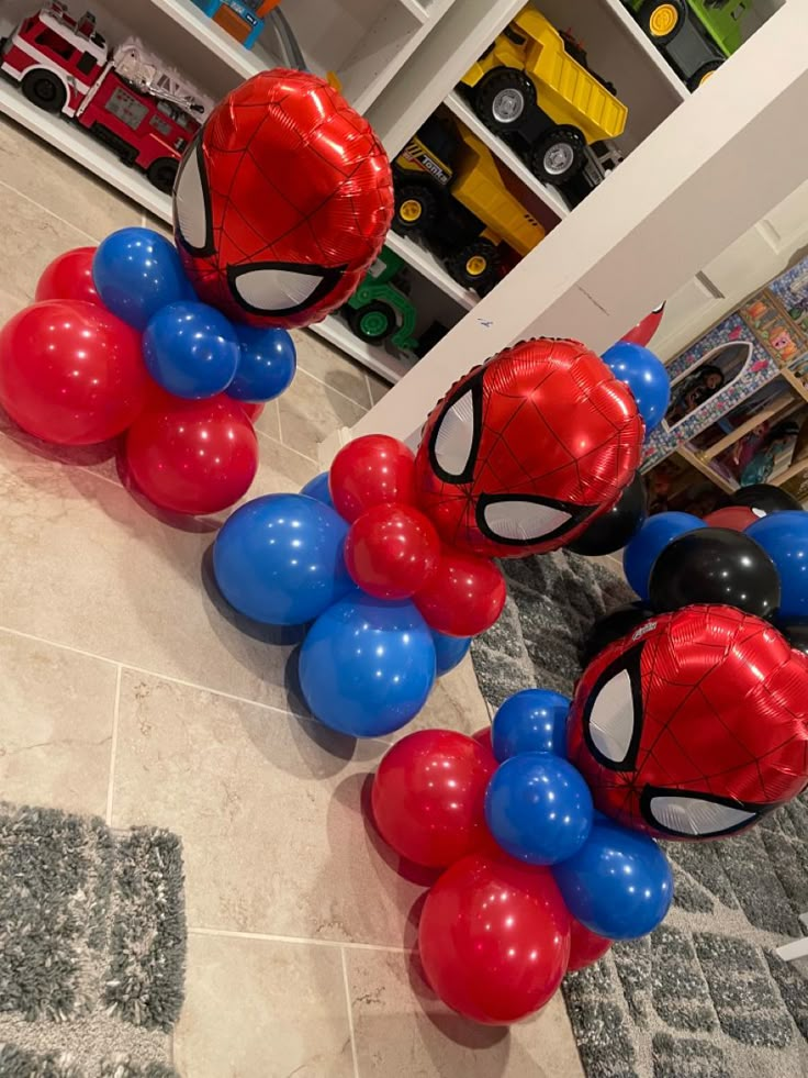 some balloons are in the shape of spider - man