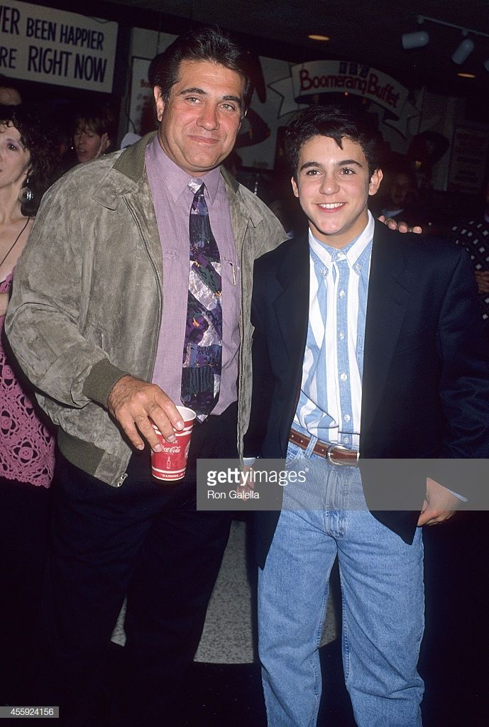 two men standing next to each other at an event