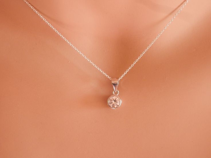 rose gold diamond necklace April birthstone necklace solitaire necklace diamond choker tiny diamond necklace delicate tiny CZ necklace Sterling silver 925 or gold vermeil (gold over sterling silver 925) delicate chain runs through a small sterling silver rhodium plated 925 or gold vermeil pendant. The pendant has in the middle a beautiful small sparkilng cz. The gold vermeil pendant can be yellow or rose gold. You can layer this cz pendant necklace with chain necklaces or charm necklaces! A beau Minimalist Jewelry With Prong Setting For Anniversary, Silver Fine Jewelry With Diamond Cut, Silver Diamond Cut Fine Jewelry, Jewelry With Round Cut Bezel Setting, Fine Jewelry Silver Round Pendant, Sterling Silver Round Necklace Fine Jewelry, Fine Jewelry Sterling Silver Round Necklace, Sterling Silver Round Fine Jewelry Necklaces, Sterling Silver Round Necklaces Fine Jewelry