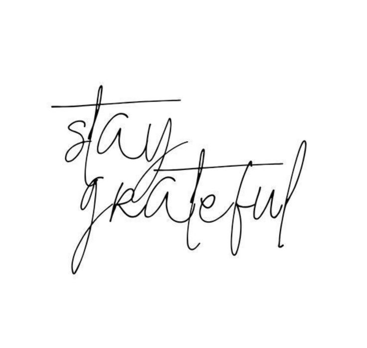 the word stay grateful written in cursive writing on a white background with black ink