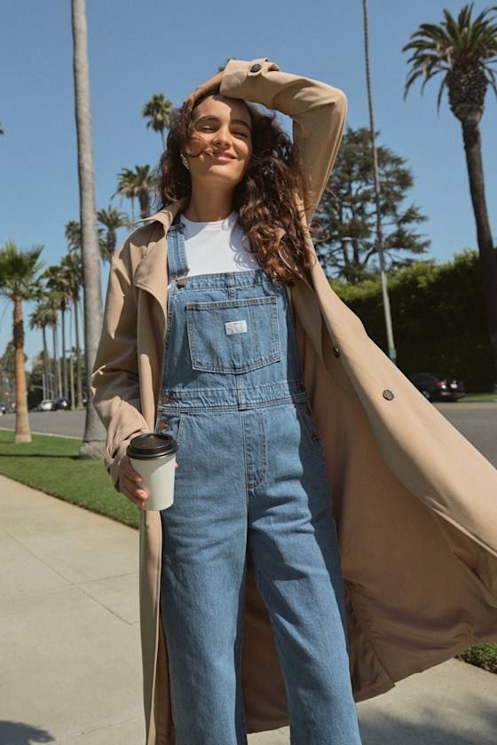 The Levi's Vintage Medium Blue Overalls are a tried and true staple that we know you're going to love! Sturdy denim (in Levi's Foolish Love wash) shapes these classic overalls that have a front bib with a patch pocket (with a logo tag) and adjustable straps that form into a modified racerback. A seamed waist tops relaxed fit straight leg bottoms with two front pockets and two back pockets. Branded button closures at the hips. Red logo tag at back. Fit: This garment fits true to size. Length: Flo Jean Overall Outfits, Levis Overalls, Overalls Winter, Overalls Vintage, Vintage Overalls, Blue Overalls, Overall Outfit, Carhartt Women, Logo Tag