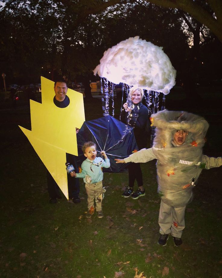 two children and an adult are dressed up as characters from the animated movie pacman