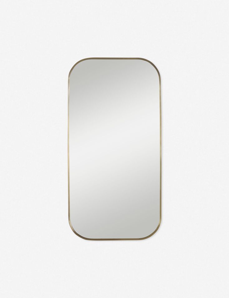 a rectangular mirror on a white wall