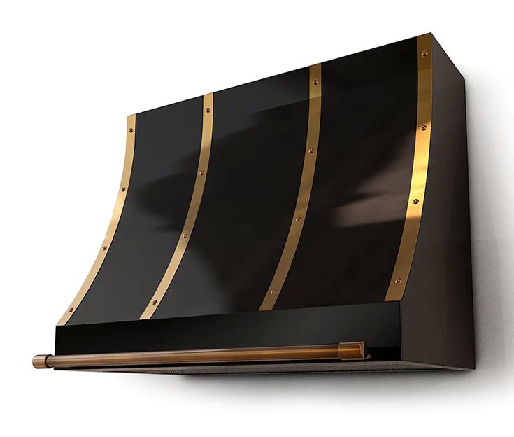 a black and gold wall mounted range hood