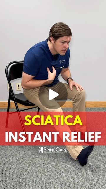 a man sitting on top of a chair in front of a red sign that says sciatica instant relief