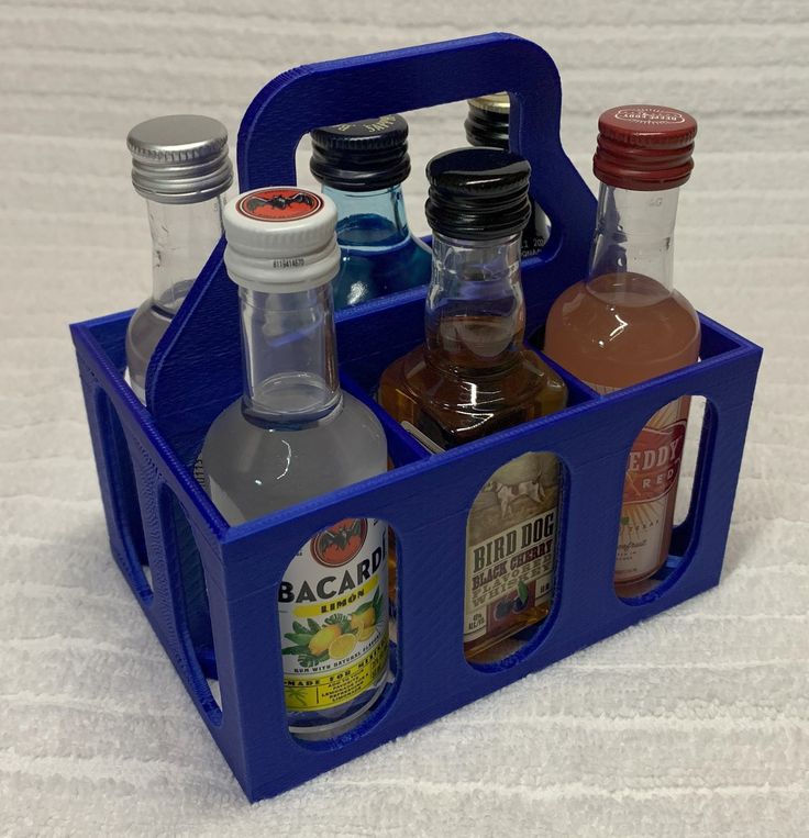 a blue caddy filled with liquor bottles