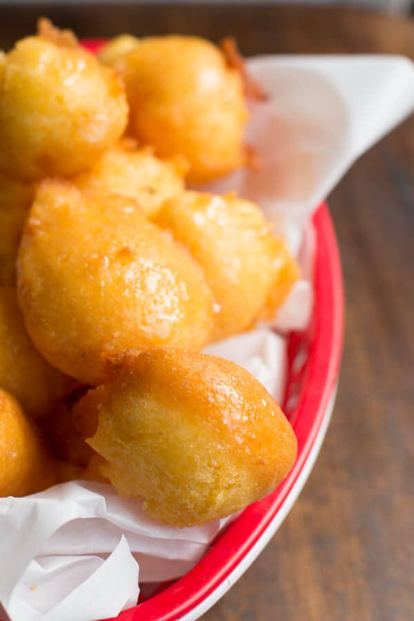 some fried food in a red bowl on a table