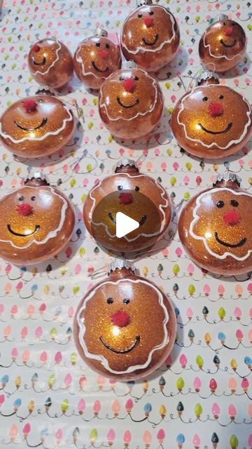 twelve christmas baubles with faces on them sitting on top of a polka dot tablecloth