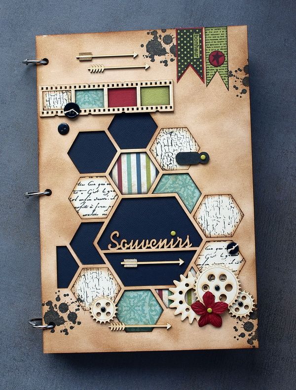 an open notebook with the word susten's on it and some gears attached to it