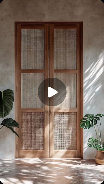 a room with two doors and some plants