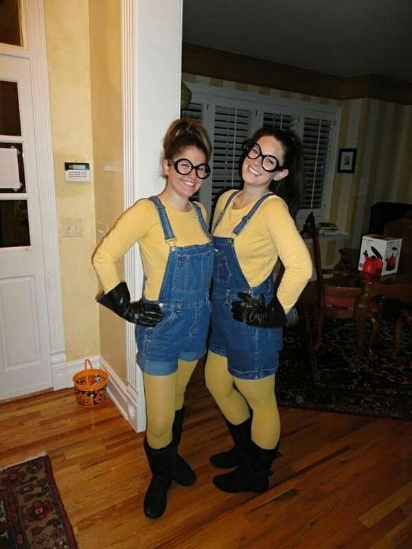 two women dressed as minions from the movie despicables posing for a photo