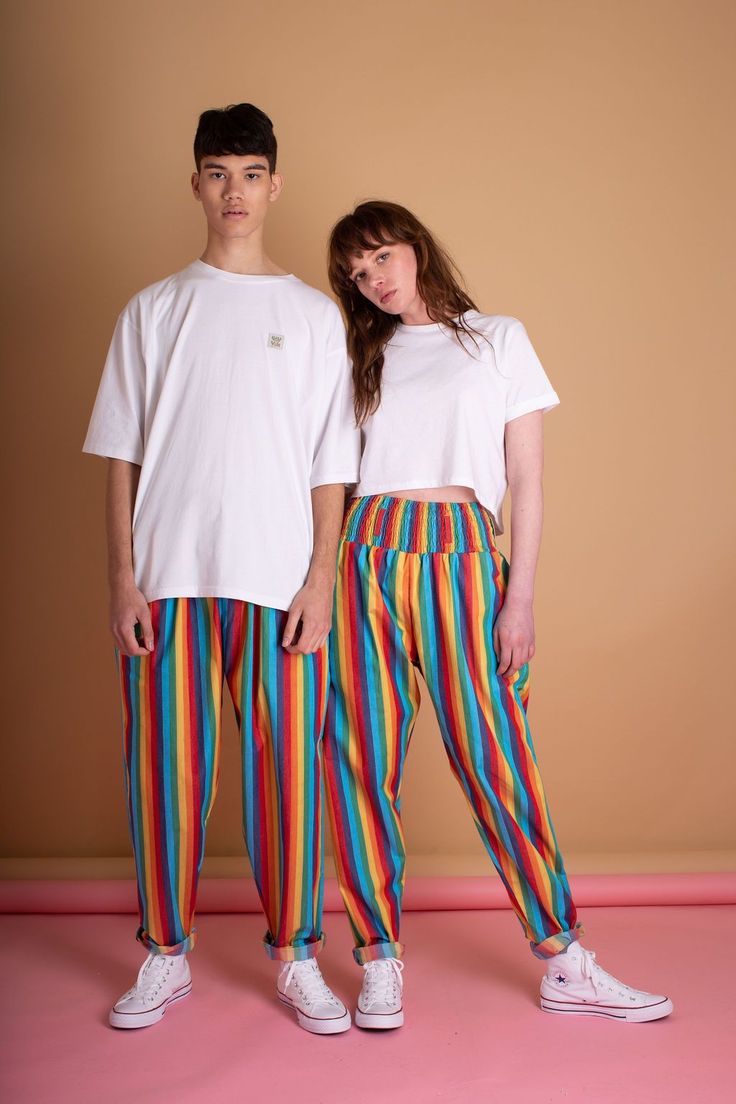 *** Facebook Group Exclusive*** 'Alexa' Organic Limited Edition Rainbow Stripe Trousers. These rainbow stripe trousers are ethically produced, like all Lucy and Yaks. These high-waisted trousers are unisex and have a fabulous big hips shape and mom style fit, with our super comfy and versatile elasticated waist. Wear with Lucy & Yak belt or on its own. These rainbow stripe trousers are handmade from 100% organic cotton. Shop rainbow trousers whilst stocks last! #rainbow #trousers Collaboration Photography, Streetwear Poses, Rainbow Pants, Lucy And Yak, Comfy Clothing, Couple Tees, Trouser Design, Unisex Clothes, Pride Outfit