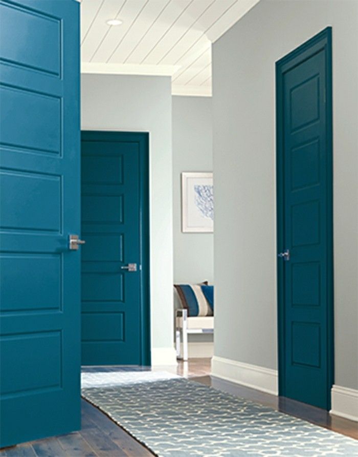 an open door in a room with blue doors