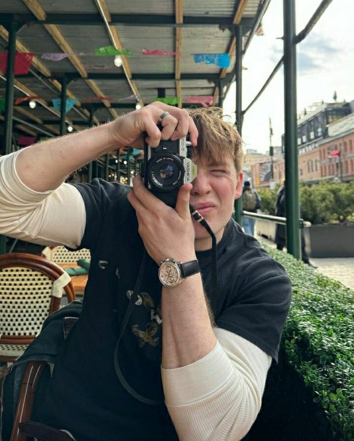 a man taking a photo with his camera