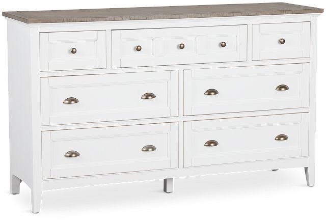 a white dresser with wooden top and drawers on it's sides, against a white background