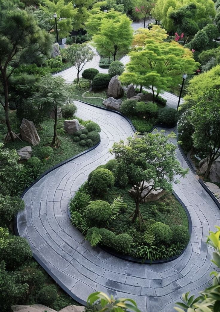 an aerial view of a garden with rocks, trees and stones in the middle of it