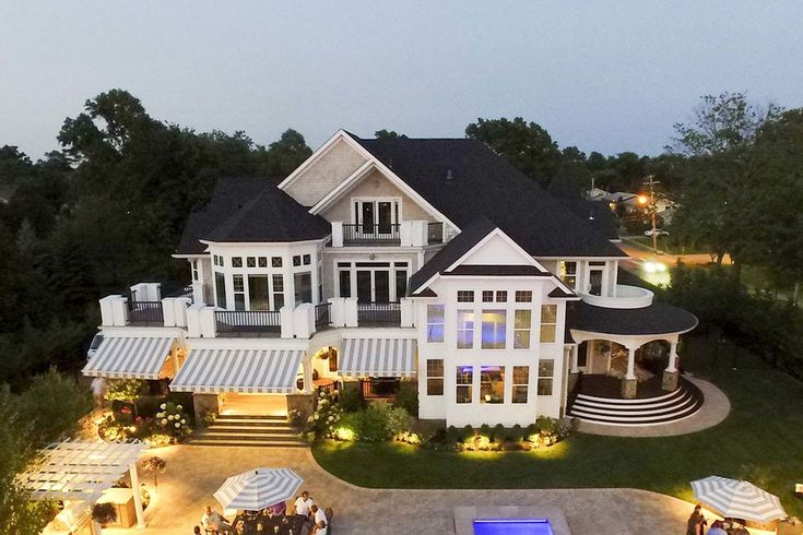 an aerial view of a large house at night