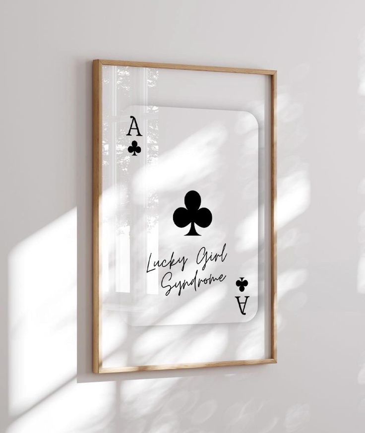 a playing card is hanging on the wall