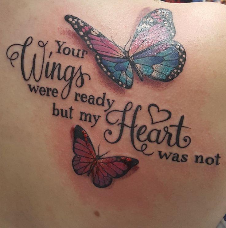 the back of a woman's shoulder with two butterflies on it and an inscription that reads, your wings were ready but my heart was not