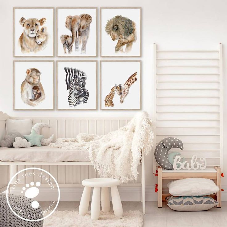 a bedroom with white walls and pictures on the wall, including an animal bed frame