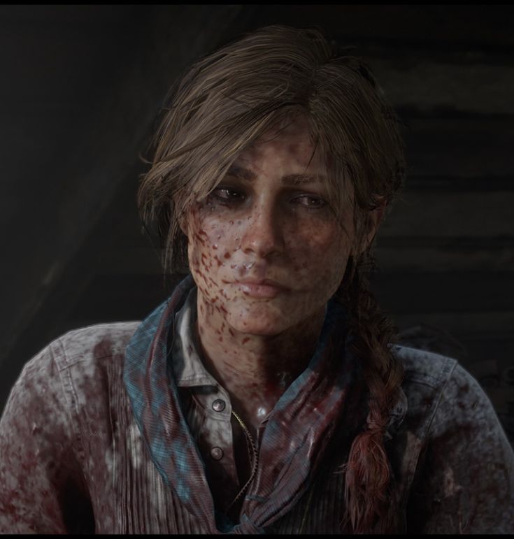 a woman with blood on her face standing in front of a dark room and looking at the camera