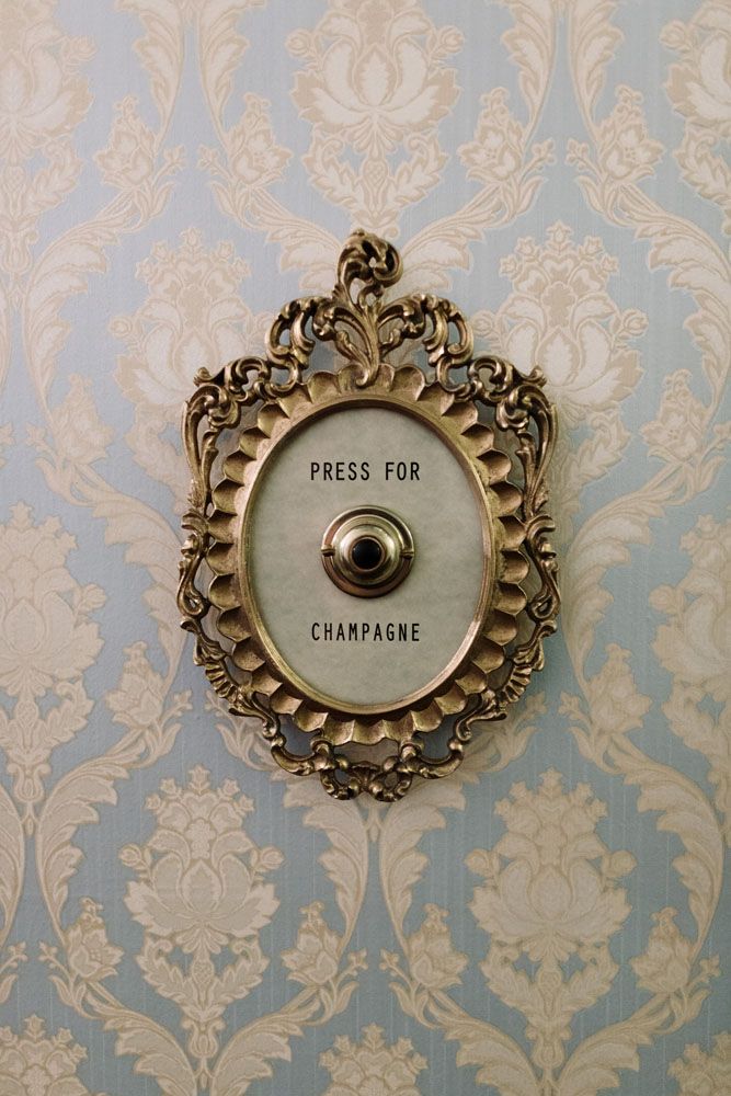 an old fashioned wall switch with the word press for champagne on it's cover