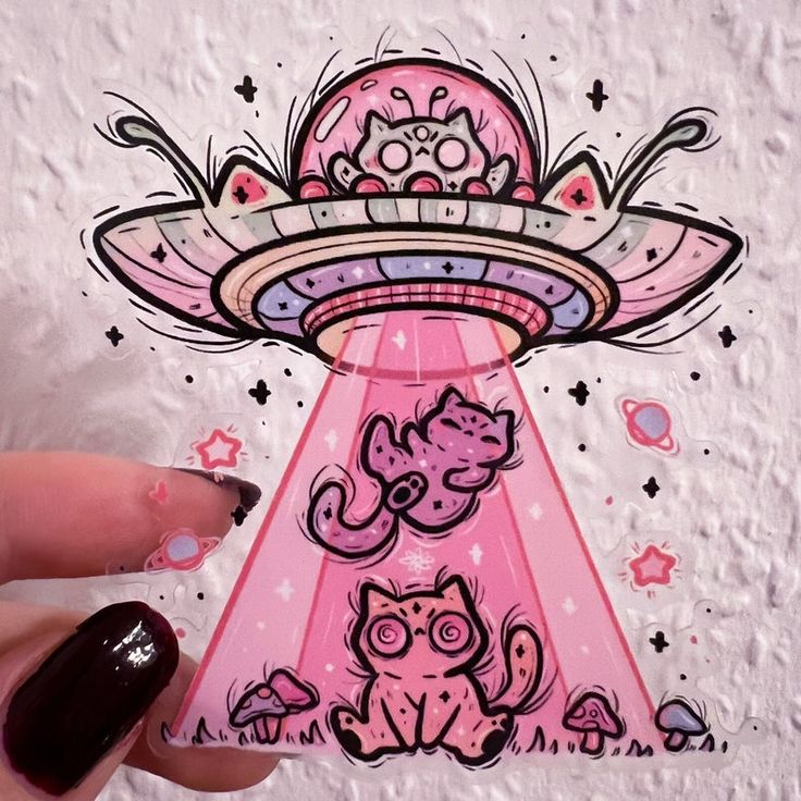 an alien cat sitting in front of a pink object with stars on it's side