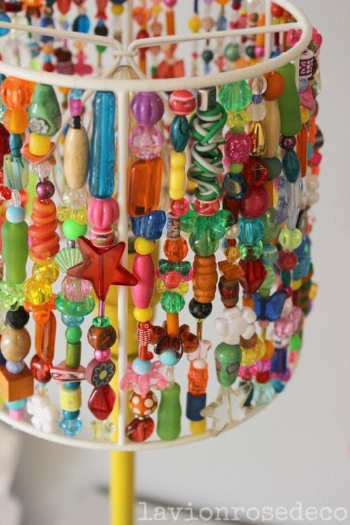 there is a lamp that has many beads on it