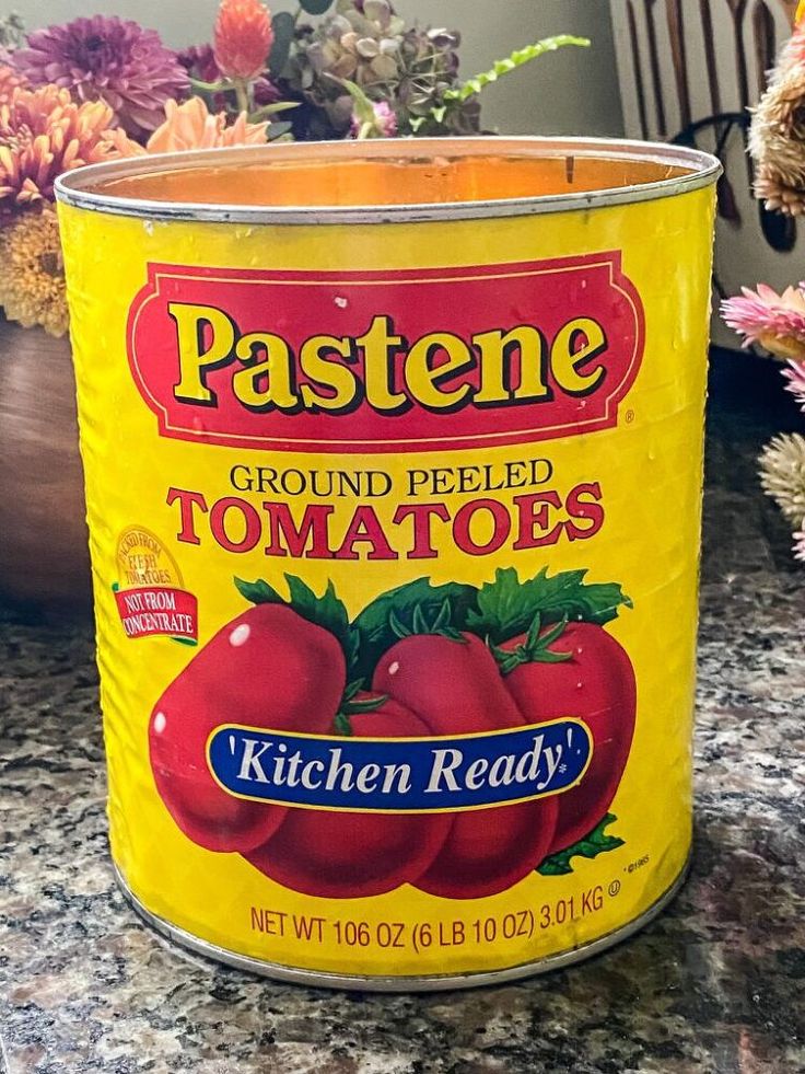 a can of tomatoes sitting on top of a counter