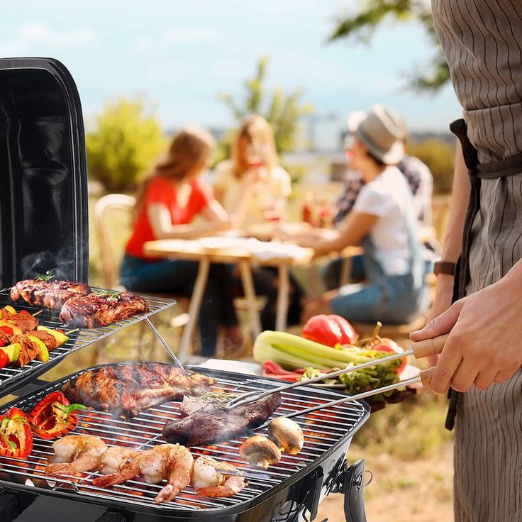 two people are grilling food on the grill