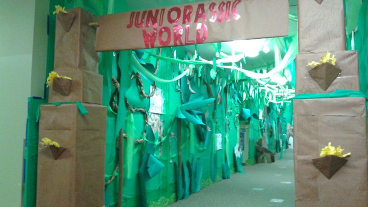 the entrance to an unforal world exhibit is decorated in green and brown paper bags