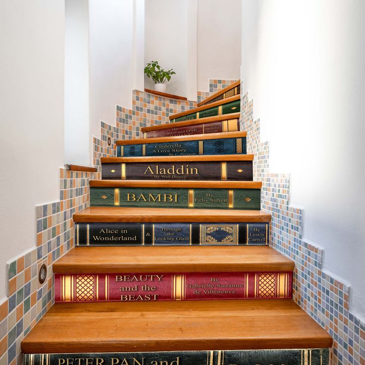 there are many books that are on the stairs