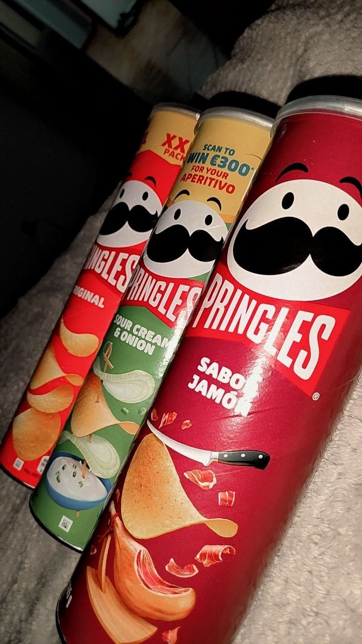 four cans of potato chips with mustaches on them