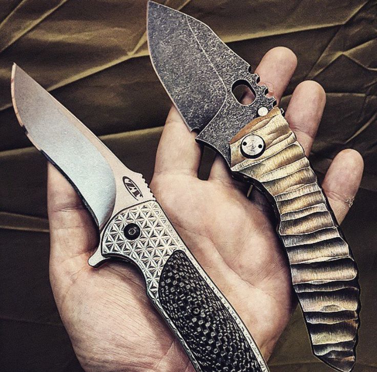 a person holding two different types of knives in their hands, one with a face on it