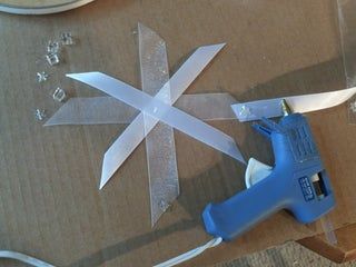 a pair of scissors sitting on top of a cardboard box