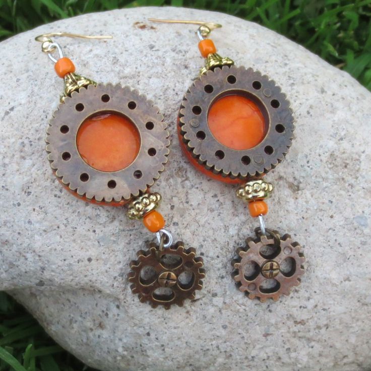 Hand Crafted Tangerine With Bronze-Tone Gears Lightweight Steampunk Dangle Statement Pierced Earrings New With Tags - Designed & Handmade By Me Alex 8 Essential Earrings For Anyone With Modern Victorian, Eclectic, Hippy, Flower Child, Boho, Gypsy Or Festival Tastes One Of A Kind Style To Elevate Your Mood & Outfit - Vintage Vibes With A Contemporary Twist Tangerine Orange Base With Antique Brass Tone Gear Overlay & Dangles Gold Tone Metal Findings Detail Amazingly Lightweight High Quality & Dura Handmade Orange Copper Earrings, Unique Orange Metal Earrings, Unique Orange Earrings For Festival, Orange Metal Earrings, Nickel-free Orange Earrings For Festival, Orange Metal Pierced Earrings, Orange Pierced Metal Earrings, Orange Festival Earrings For Pierced Ears, Victorian Eclectic