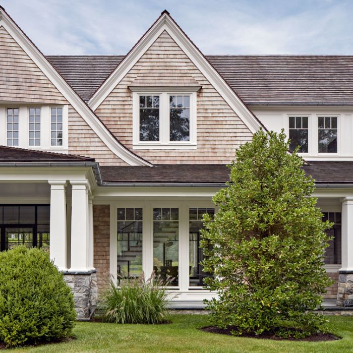 a large house with white trim and windows