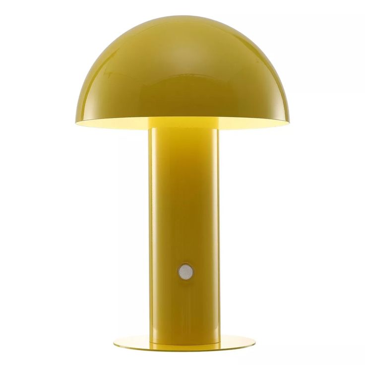 a yellow table lamp sitting on top of a white floor