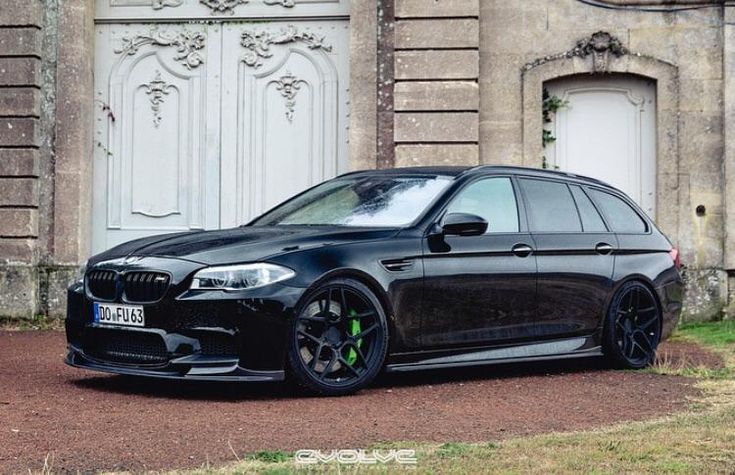 a black car parked in front of a building