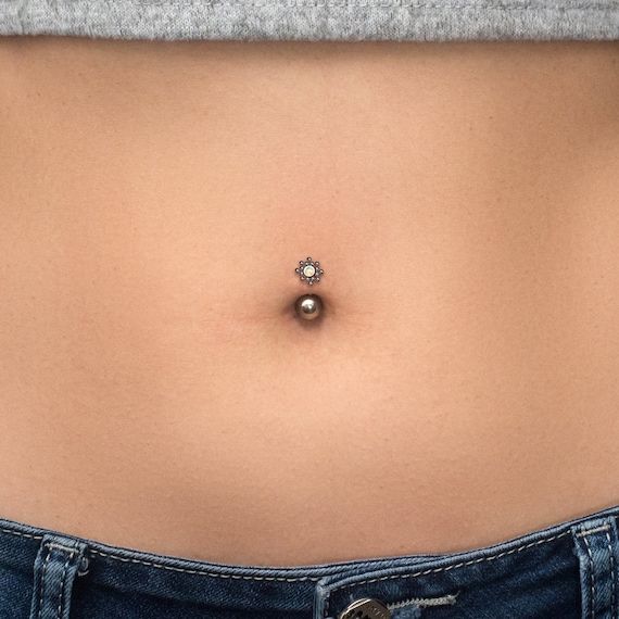 Titanium belly ring. This listing is for a single item. ITEM MEASUREMENTS:Available gauges (thickness of barbell): 16g, 14gAvailable bar lengths: 6mm, 8mm, 10mm, 11mmGemstone size: 2mm MATERIALS USED:We create this jewelry using the highest quality implant grade 23 Titanium (ASTM F-136) – best choice for people with sensitive skin. However, pure titanium version can be made upon request. SHIPPING & HANDLING:We will pack your jewelry with great care. It will come in a small and very cute jewe Titanium Belly Button Rings, Opal Belly Ring, Eyebrow Jewelry, Titanium Belly Ring, Barbell Earrings, Nose Earrings, Belly Button Jewelry, Navel Jewelry, Belly Jewelry