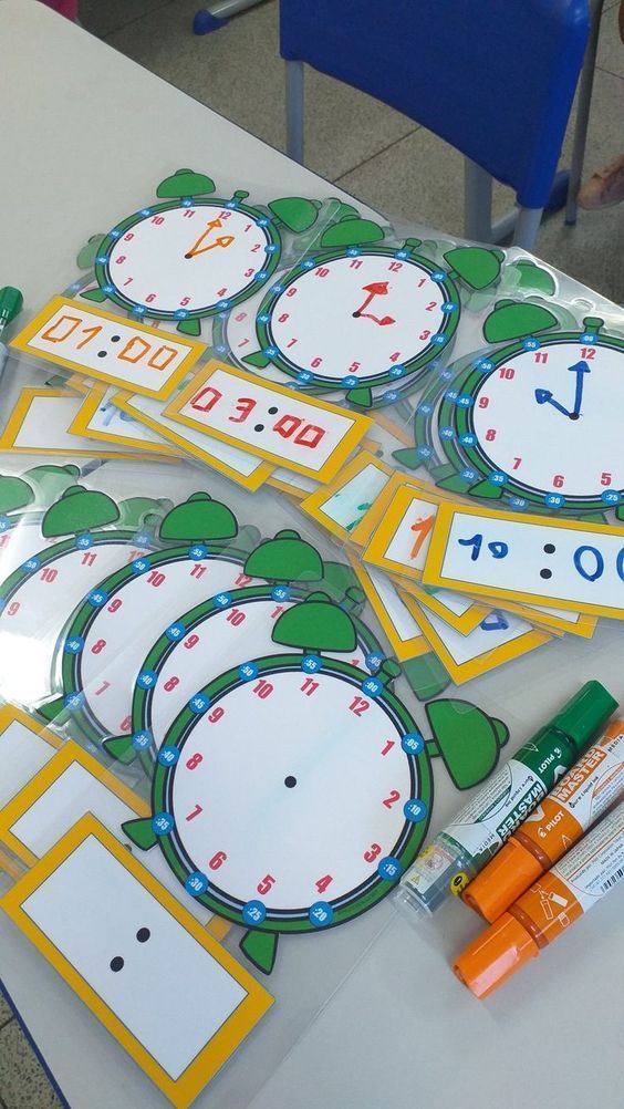 the table is set up with markers and stickers for learning numbers to 10 - 20