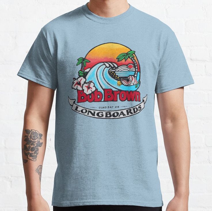 a man wearing a blue t - shirt that says bob brown's longboard