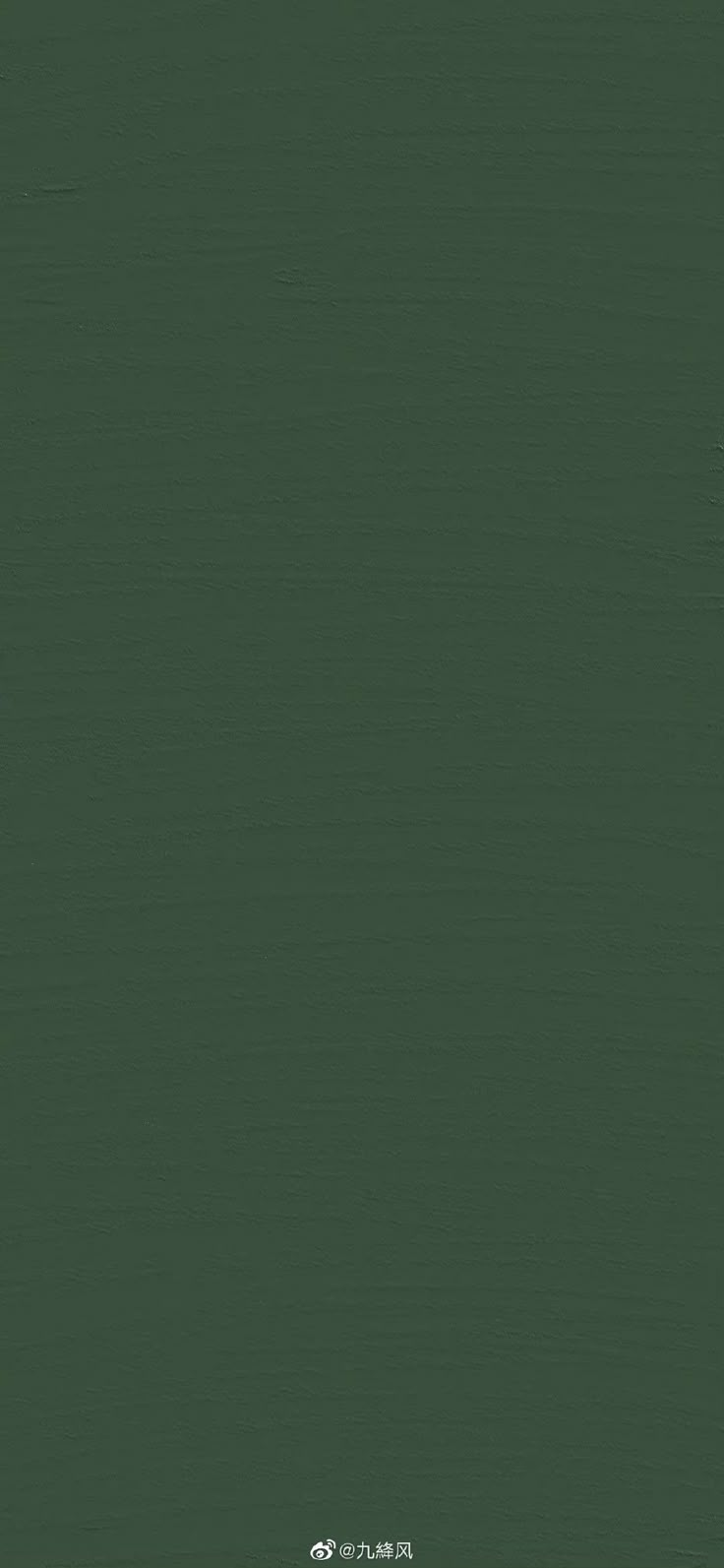 an image of a dark green background that looks like it could be used as a wallpaper