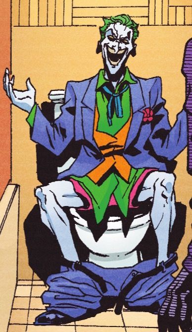 the joker is sitting down with his hands up